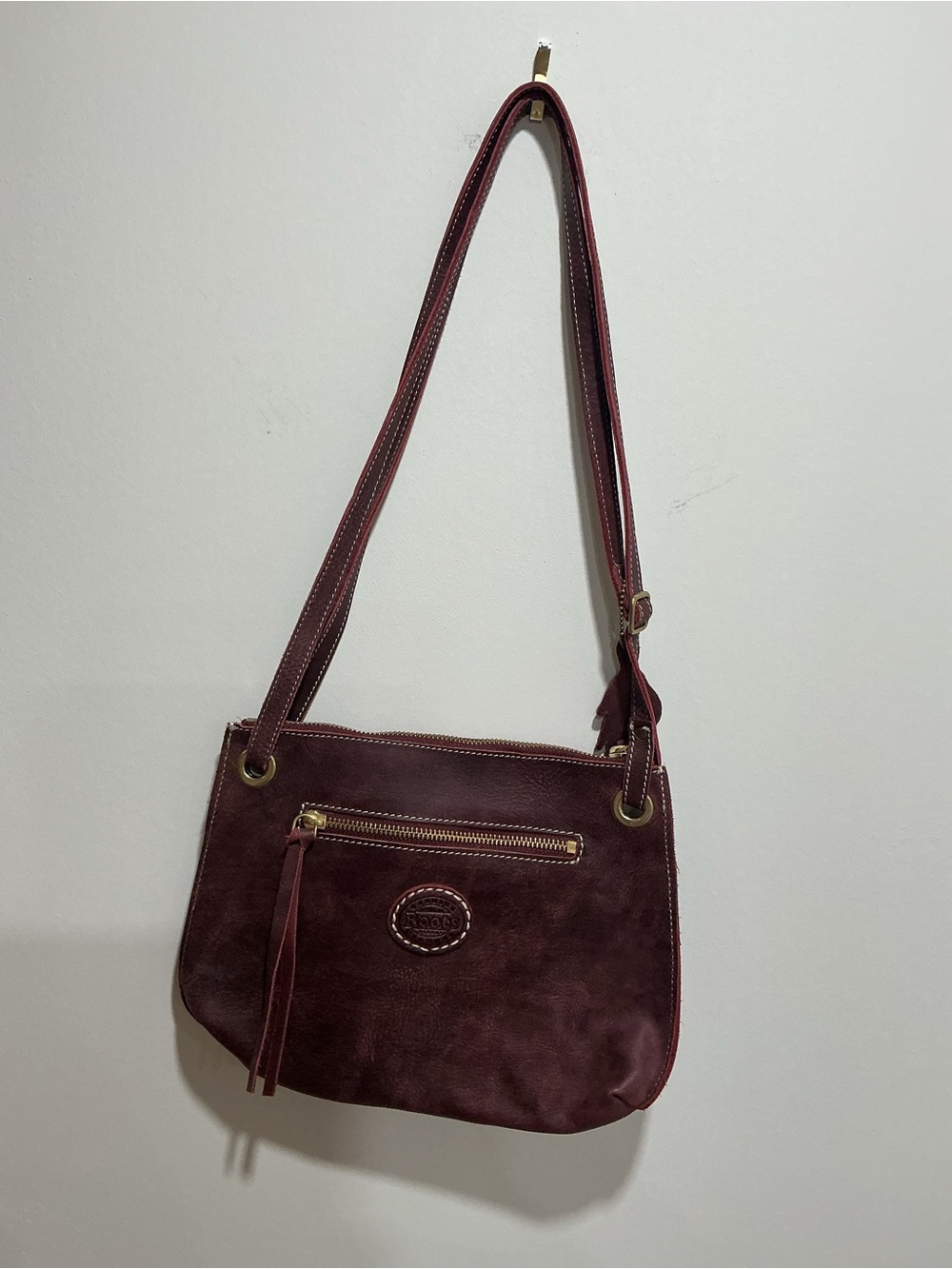 Roots Edie Cervino crossbody bag in Bordeaux colour